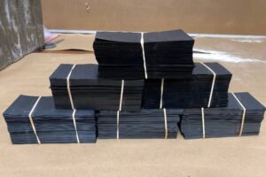 Black paper money defaced currency notes being prepared for SSD chemical solution cleaning process