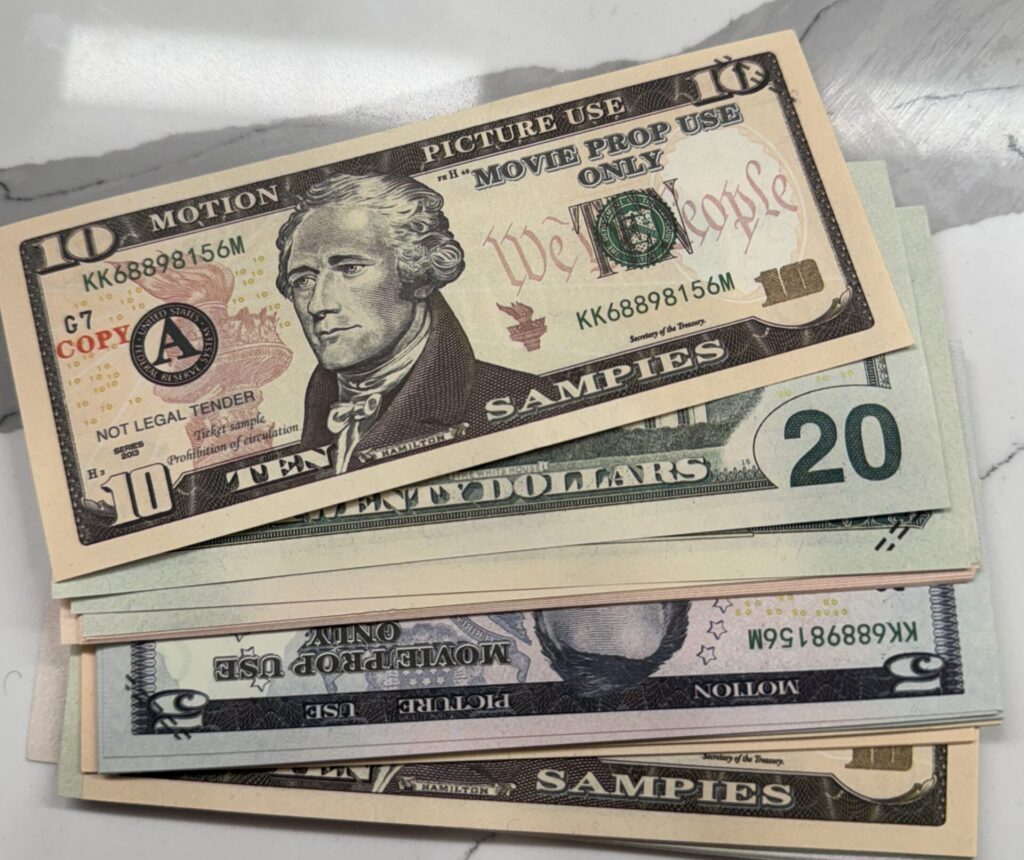 Realistic prop money for sale with US dollar Euro and Australian dollar style bills stacked together